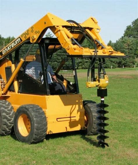 setting posts with skid steer|Digging post holes with skid steer .